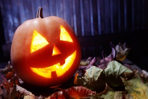 Jack o lanterns  Halloween pumpkin face on wooden background